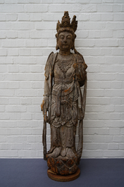 A tall Chinese carved wood figure of Guanyin, Ming